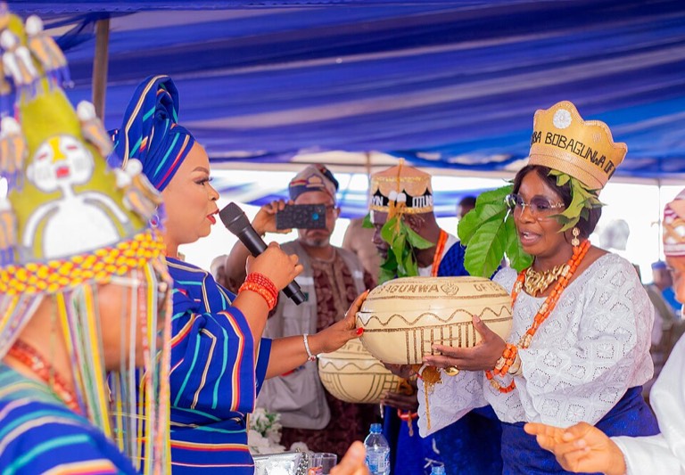 Copper structured aso-oke gown with gele